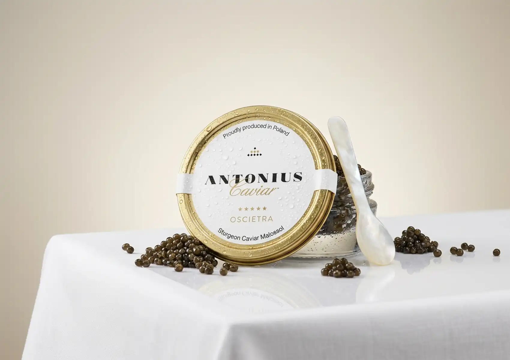 Antonius Oscietra caviar served with a mother-of-pearl spoon on an elegant dining table.