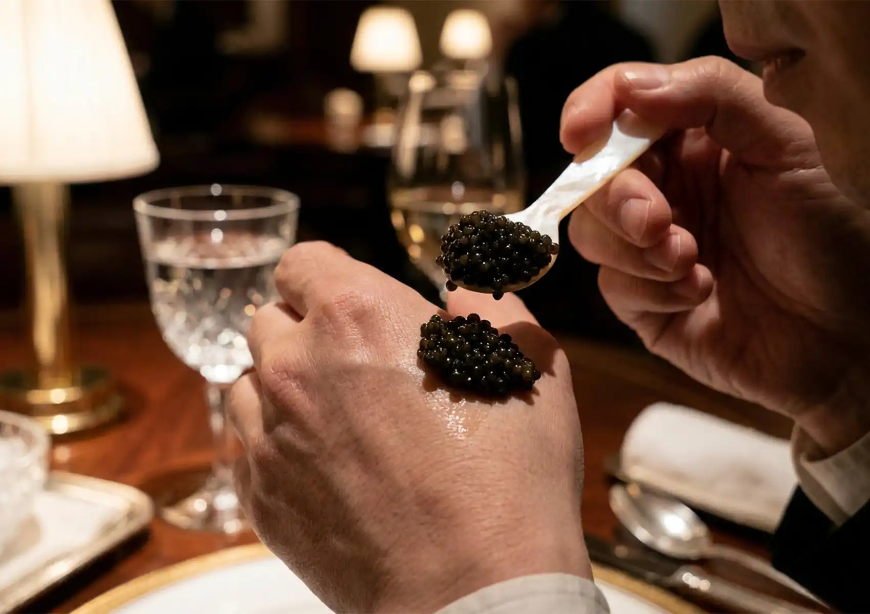 Luxury caviar bump tasting with Siberian Sturgeon caviar served on a mother-of-pearl spoon.
