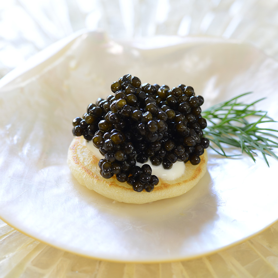 Caviar served on a blini.