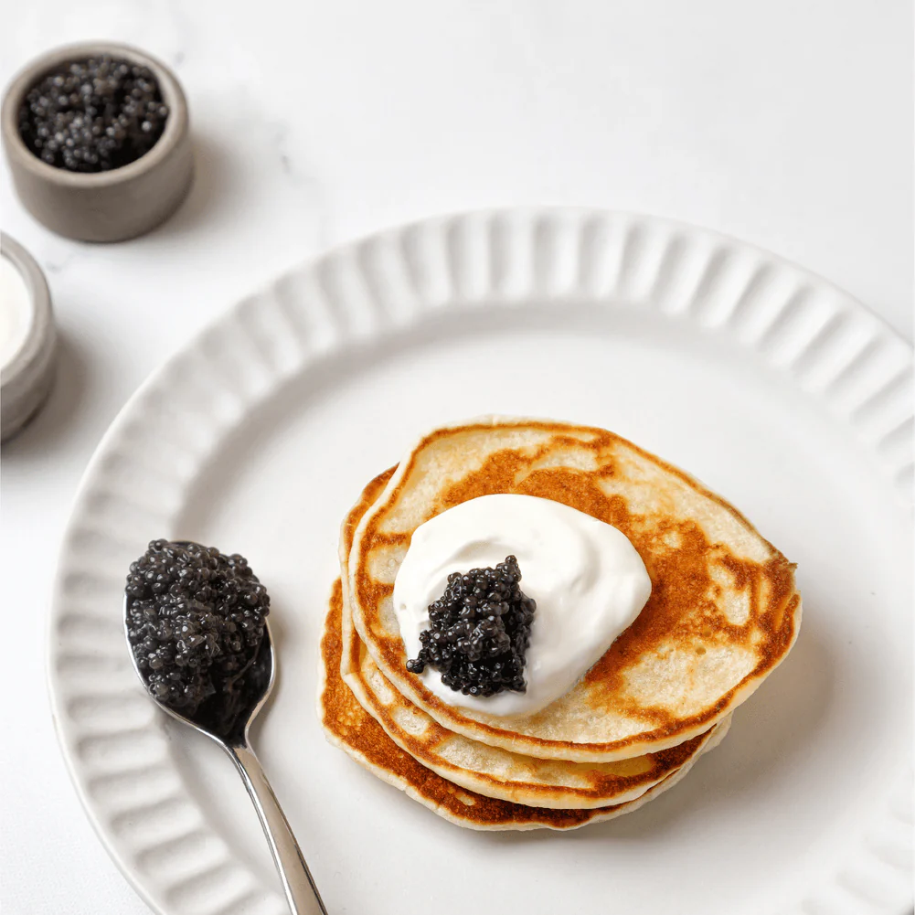 Caviar served on a blini with crème fraîche
